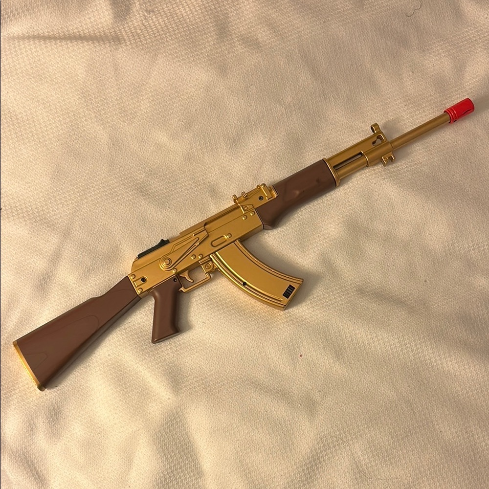 Gold and Brown Toy Rifle Lighter